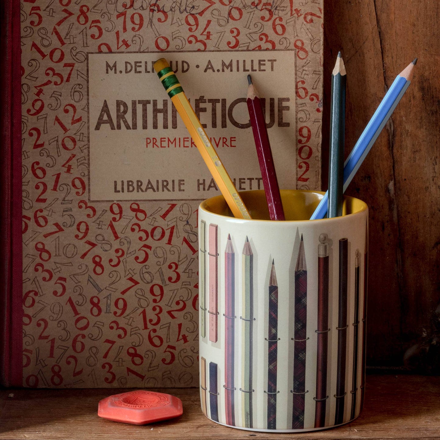 Vintage Pencils Everything Pot styled on an old wooden shelf, surrounded by vintage books and an eraser, creating a nostalgic desk scene.