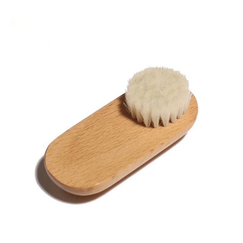 Facial brush with goat hair bristles, photographed from above close up