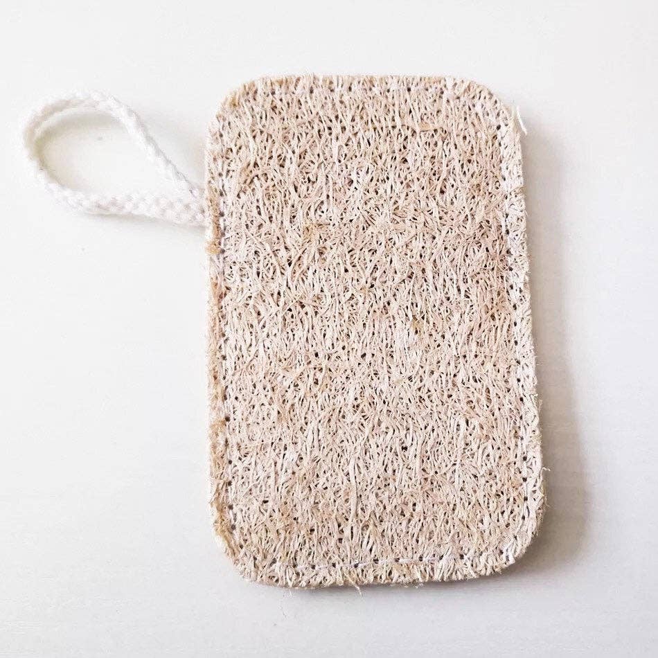 Loofah sponge with cotton hanging loop, laid flat