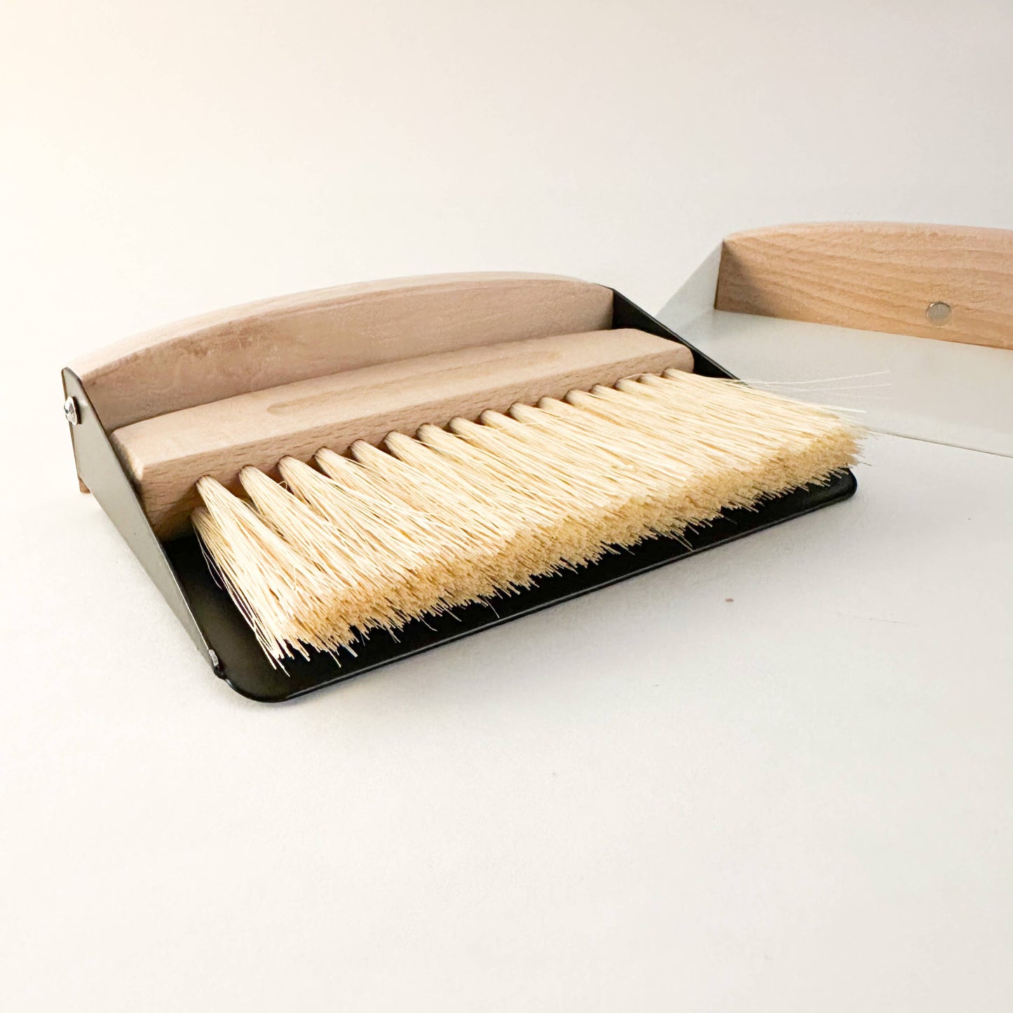 Eco-friendly compact dustpan & brush set clipped together magnetically