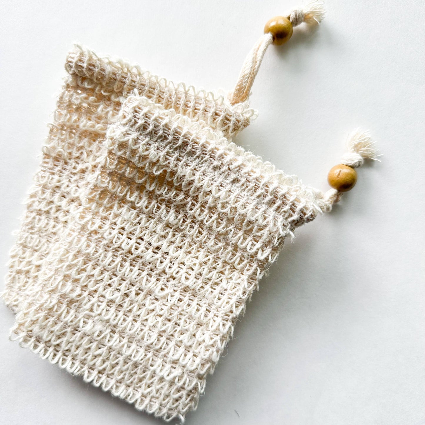two sisal soap bags with wooden beads