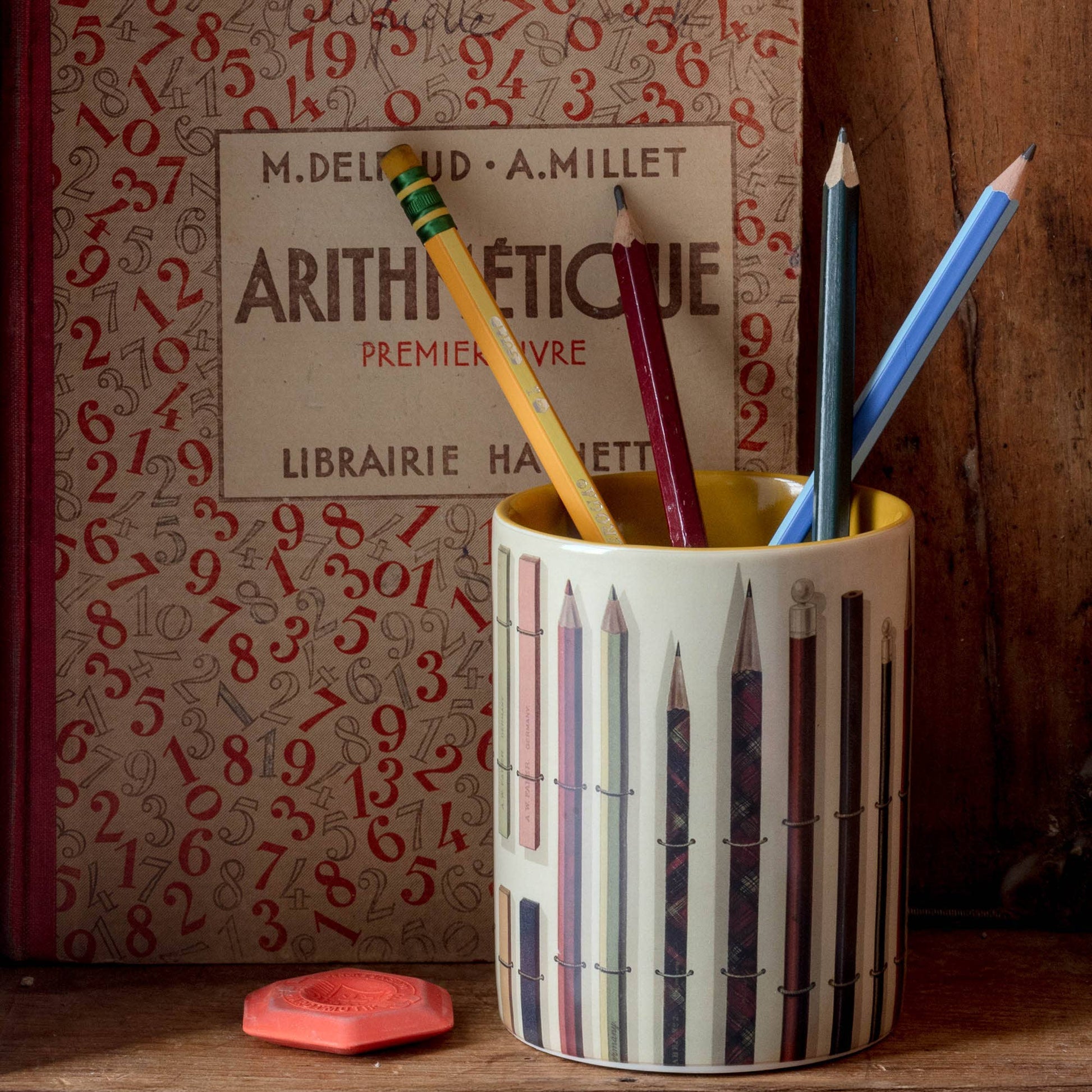 Vintage Pencils Everything Pot styled on an old wooden shelf, surrounded by vintage books and an eraser, creating a nostalgic desk scene.