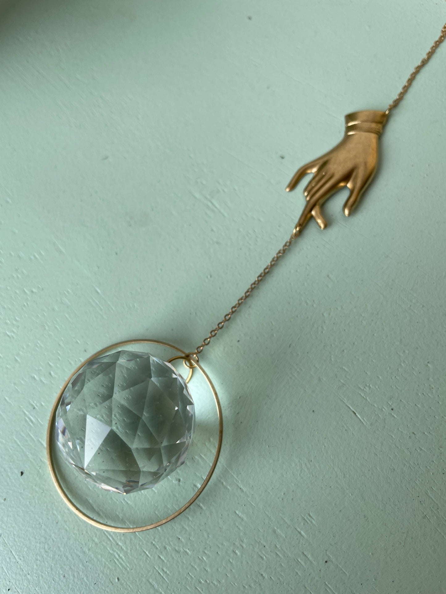 The Brass Hand Prism Suncatcher