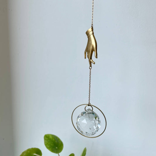 brass hand prism suncatcher 